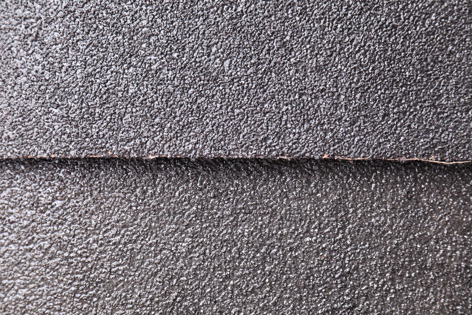 Photo of Sheets of coarse sandpaper as background, top view