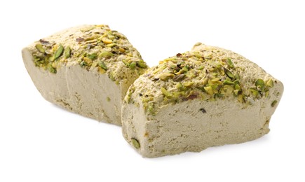 Photo of Pieces of tasty halva with pistachios on white background