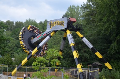 Photo of Amsterdam, The Netherlands - August 8, 2022: Colorful Tomahawk attraction in Walibi Holland amusement park