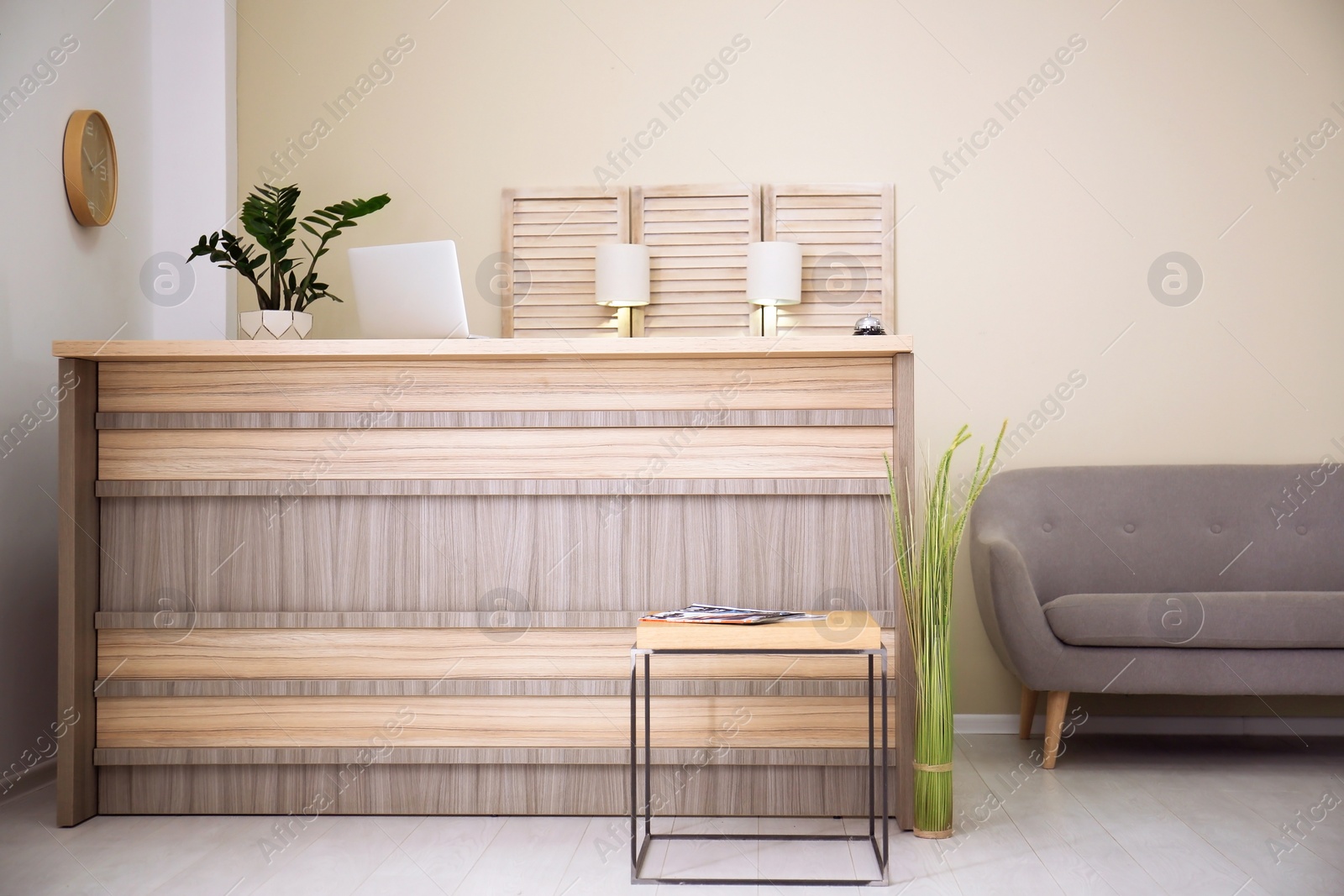 Photo of Receptionist desk in hotel. Workplace interior