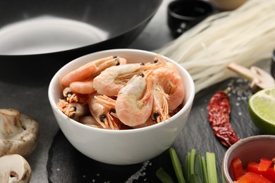 Photo of Different products for cooking wok on table, closeup