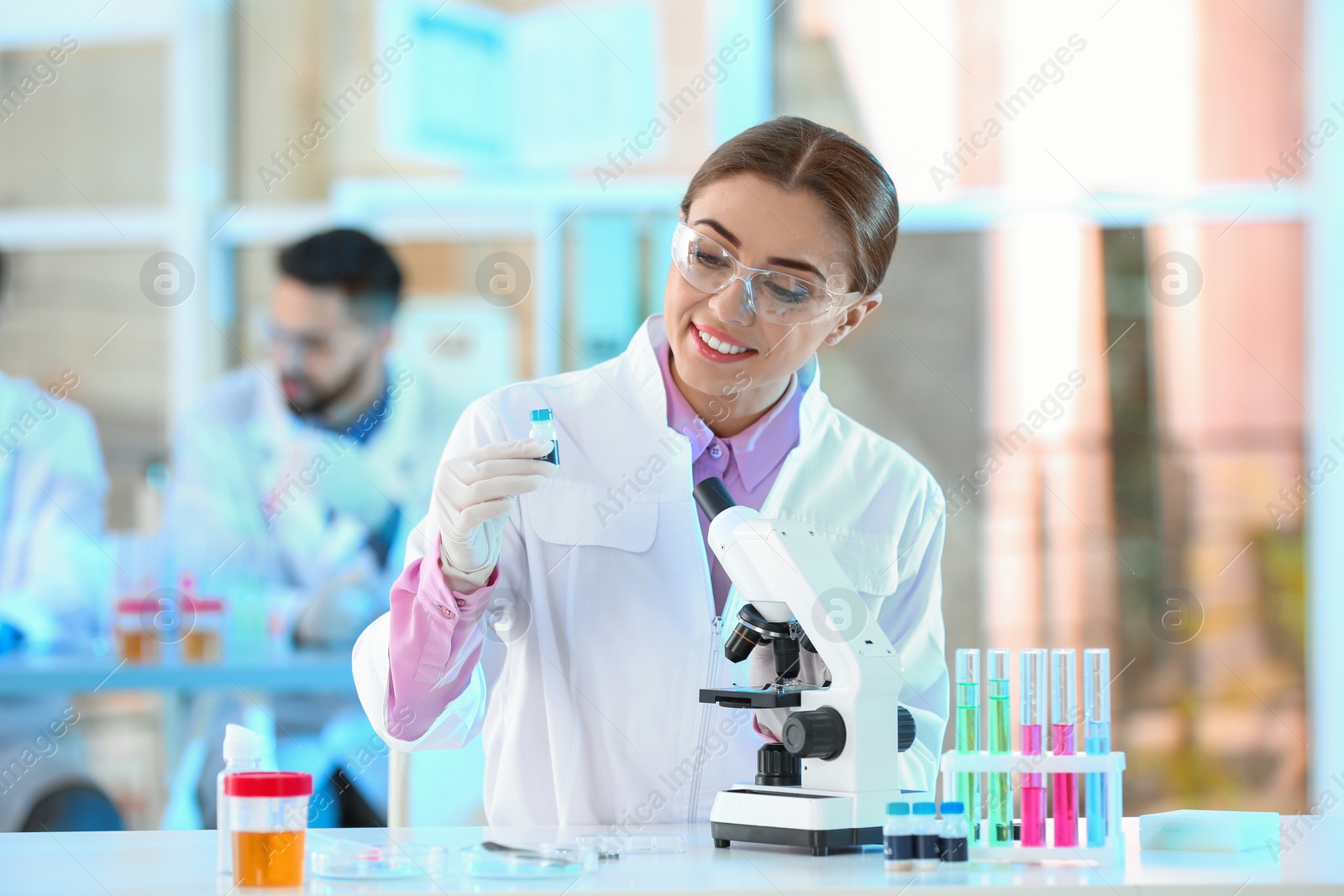 Photo of Young scientist working in laboratory. Chemical analysis