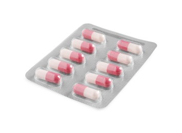 Photo of Blister of pills on white background. Medicinal treatment