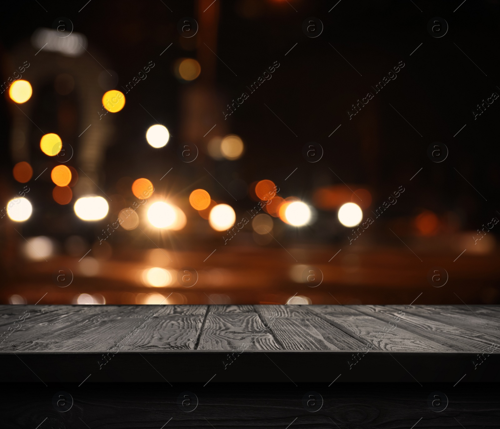 Image of Empty black wooden surface against blurred background. Space for design