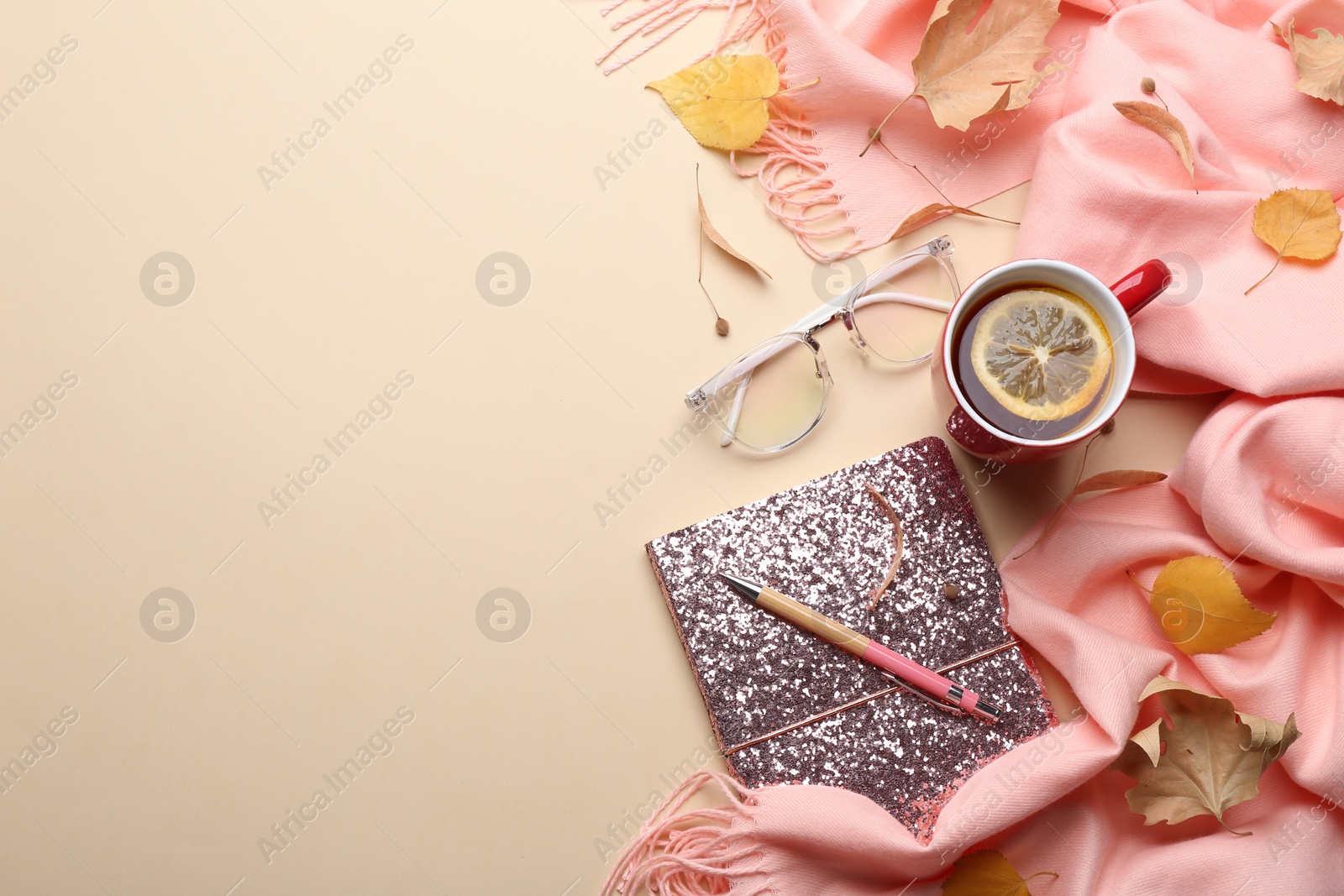 Photo of Flat lay composition with hot drink on beige background, space for text. Cozy autumn