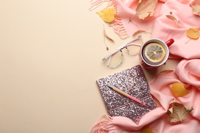 Flat lay composition with hot drink on beige background, space for text. Cozy autumn