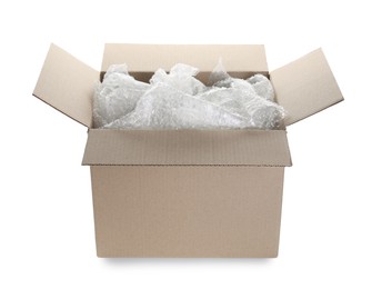 Photo of Transparent bubble wrap in cardboard box isolated on white