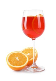 Photo of Tasty Aperol spritz cocktail in glass and halves of orange isolated on white