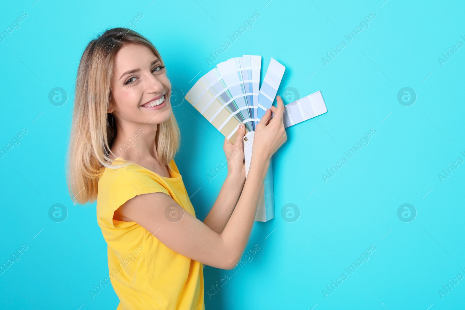 Photo of Young woman with palette on color background