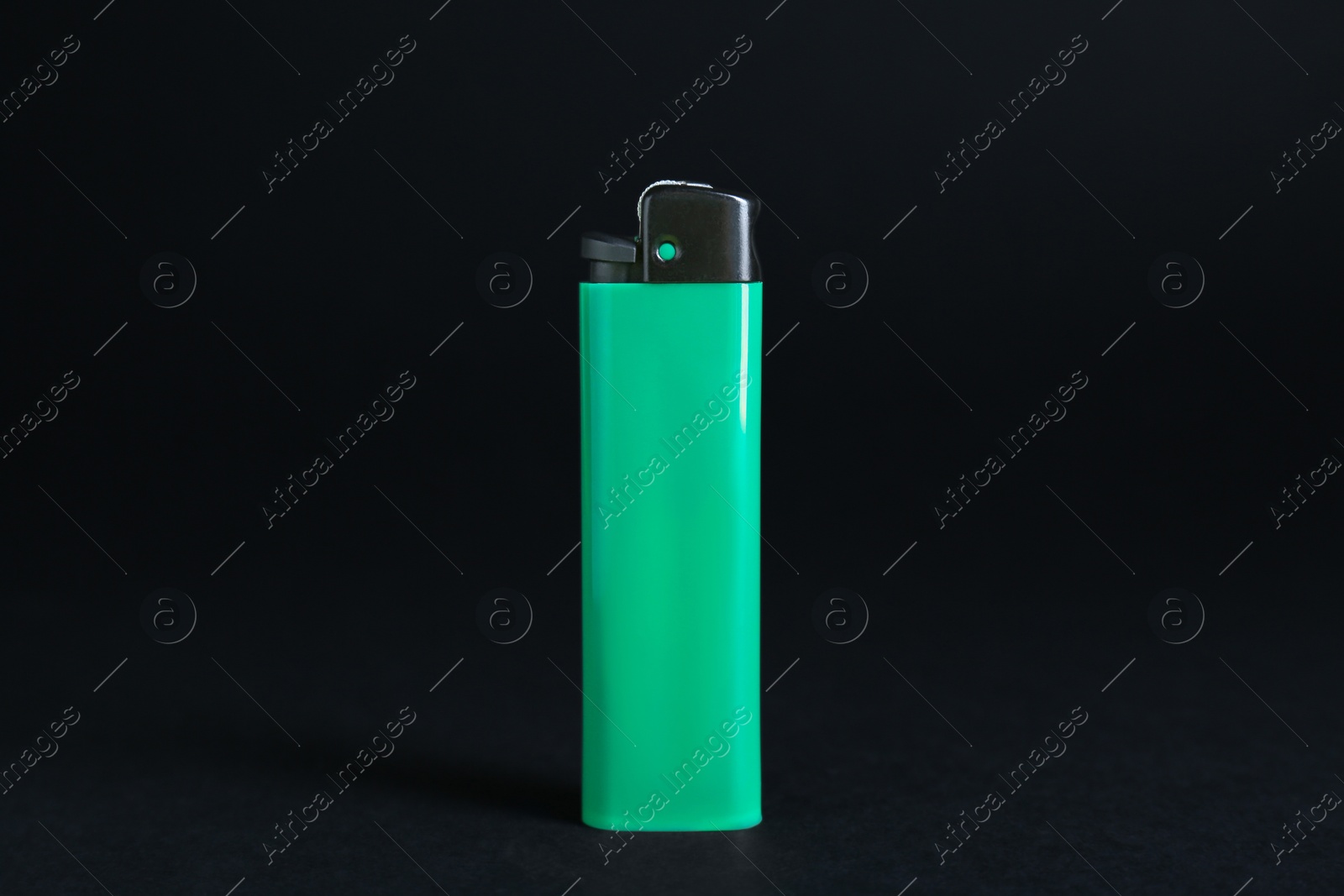 Photo of Stylish small pocket lighter on black background