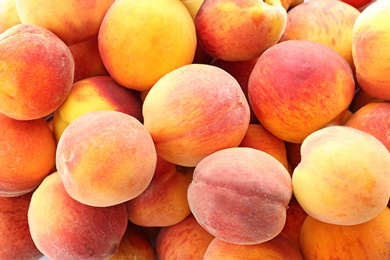 Photo of Fresh sweet peaches as background