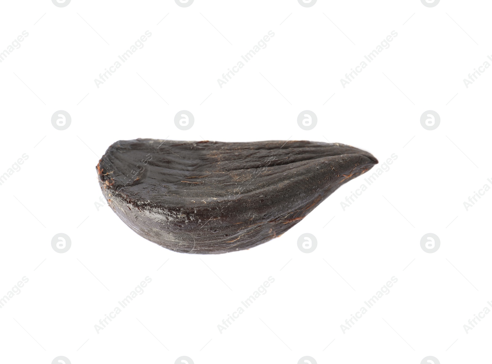 Photo of Clove of aged black garlic on white background