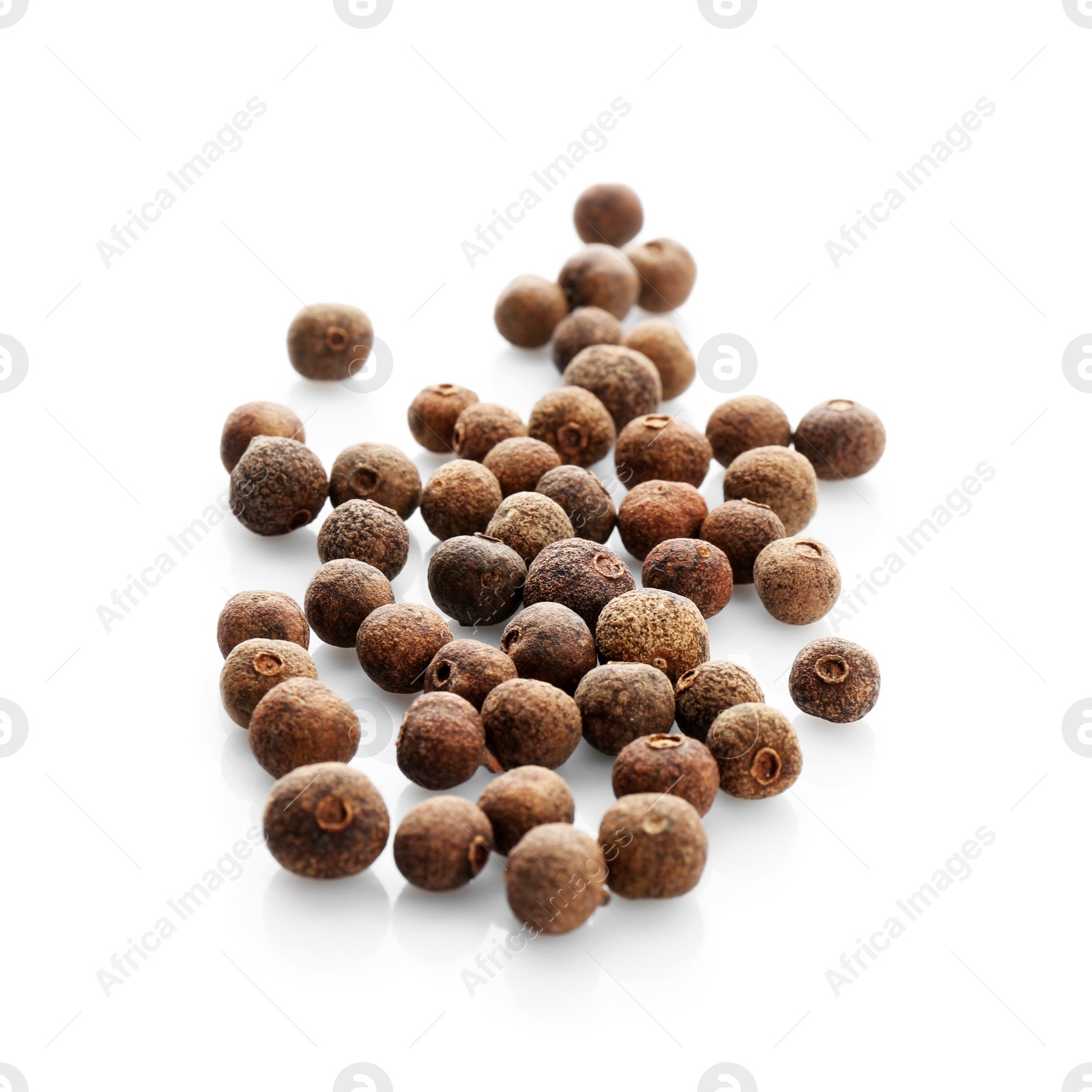 Photo of Allspice pepper grains on white background. Natural spice