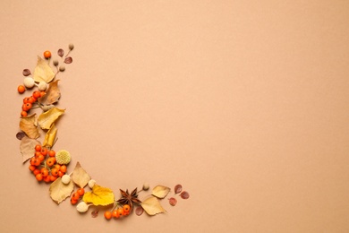 Photo of Flat lay composition with autumn leaves on beige background, space for text