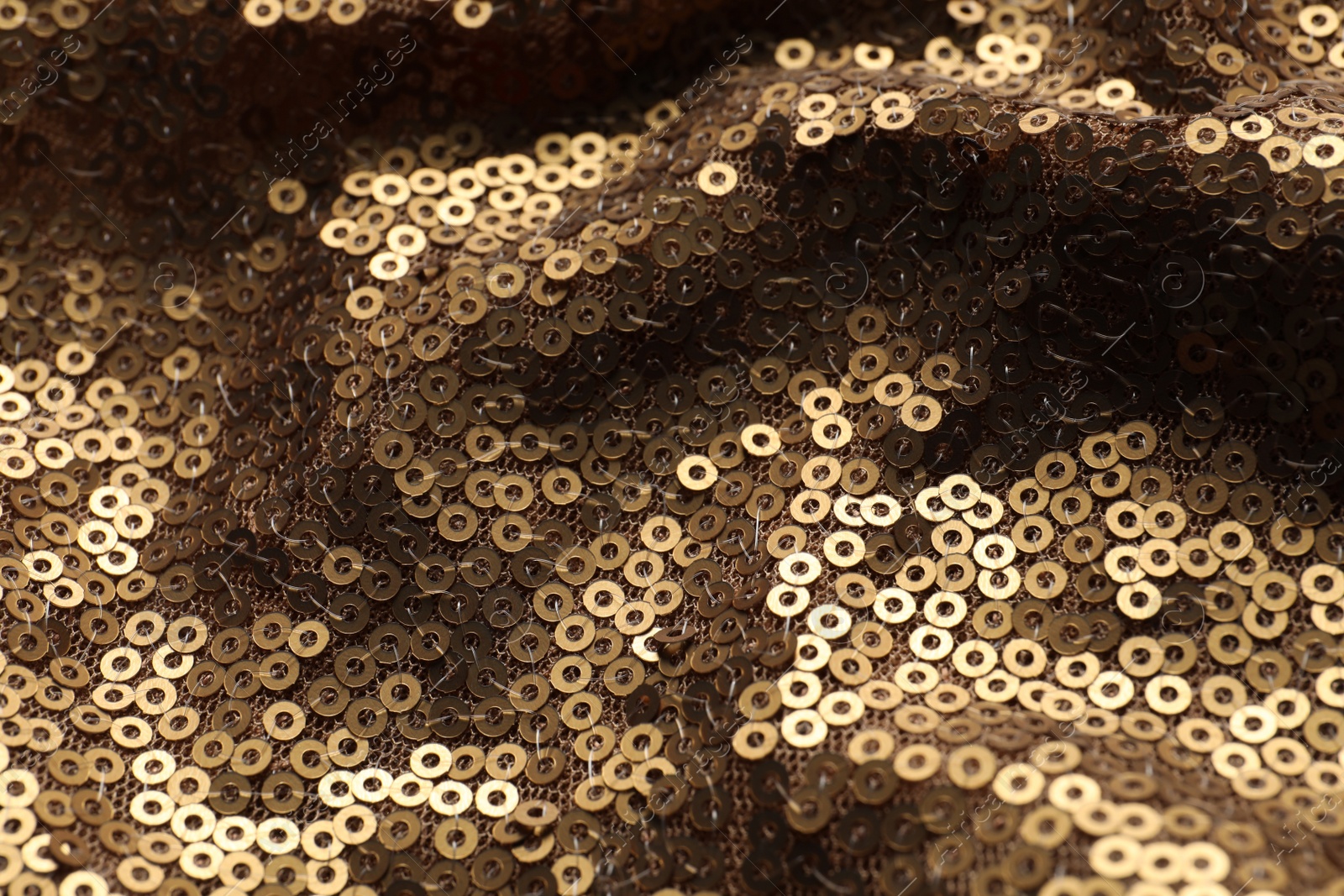 Photo of Beautiful golden sequin fabric as background, closeup