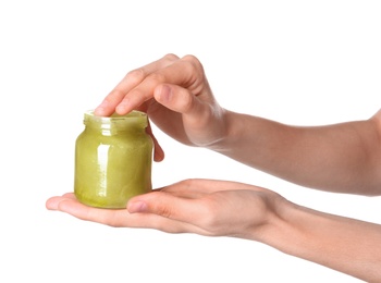 Woman with jar of hemp lotion on white background, closeup