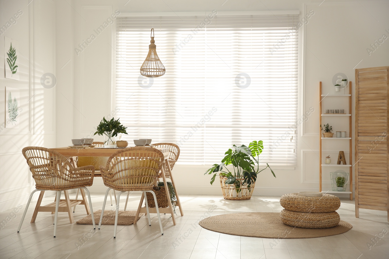 Photo of Stylish wooden dining table and chairs in room. Interior design