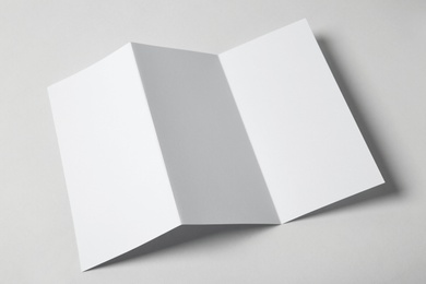 Photo of Blank brochure on white background, above view. Mock up for design