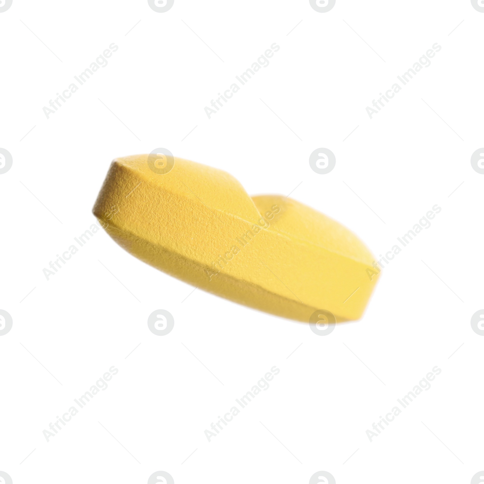 Photo of One pale orange pill isolated on white