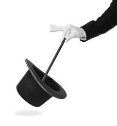 Image of Magician showing trick with wand and top hat on white background, closeup