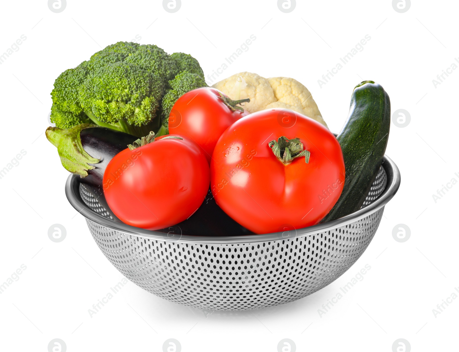 Photo of Colander with fresh vegetables isolated on white