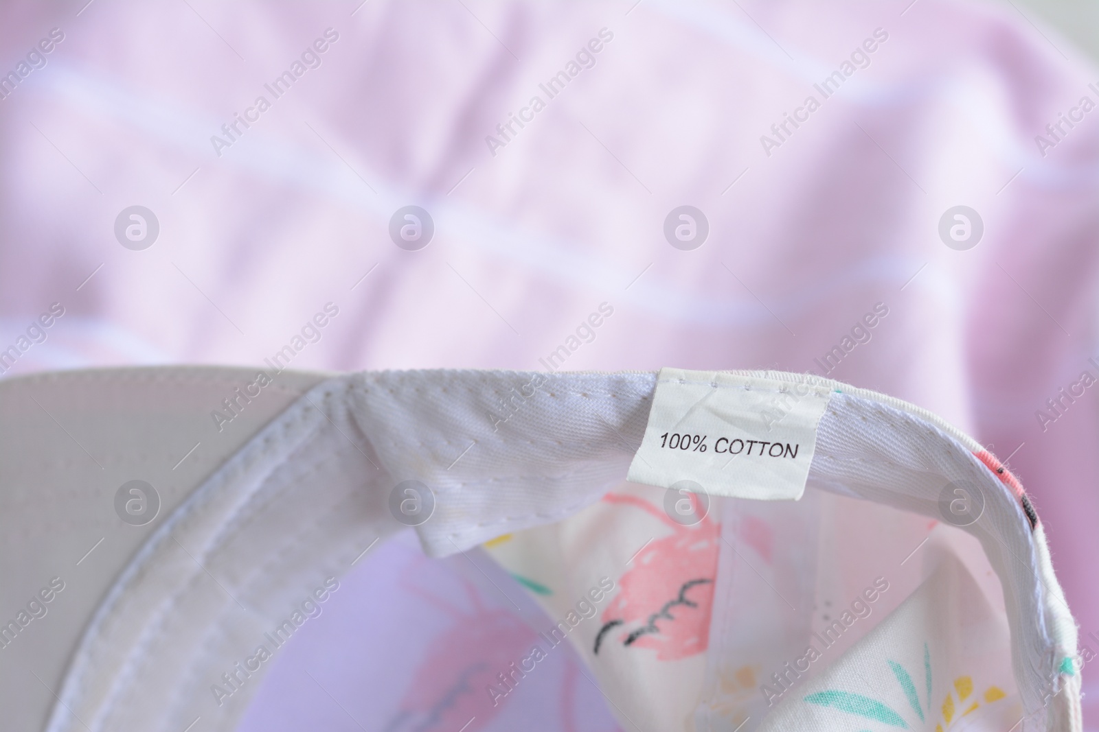 Photo of Clothing label on garment, closeup. Space for text