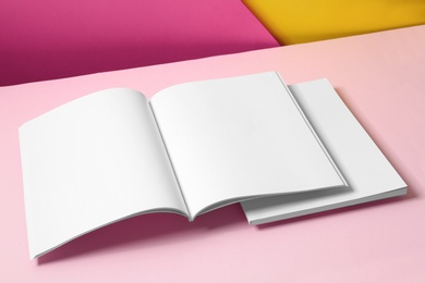 Photo of Empty book pages on color background. Mockup for design