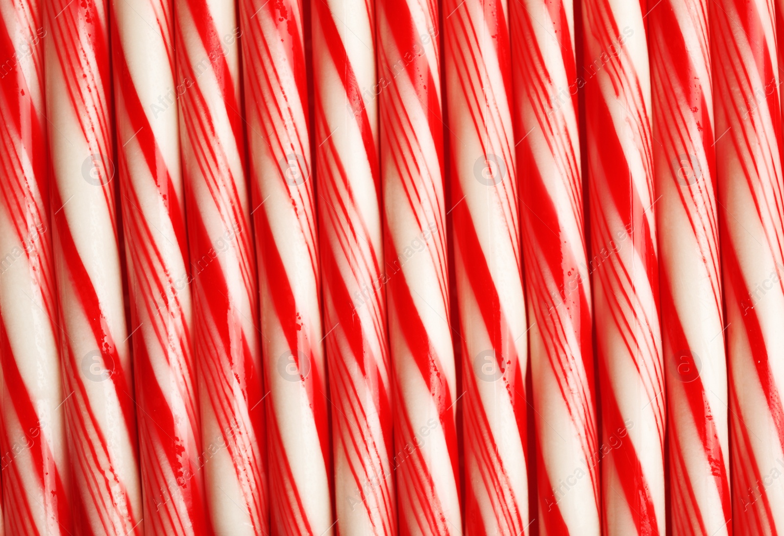 Photo of Many candy canes as background. Festive treat