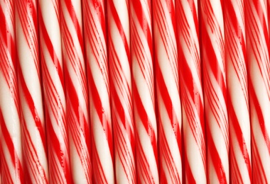 Many candy canes as background. Festive treat