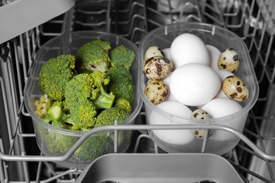 Photo of Cooking raw broccoli and eggs in modern dishwasher, closeup