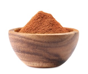 Photo of Dry aromatic cinnamon powder in wooden bowl isolated on white