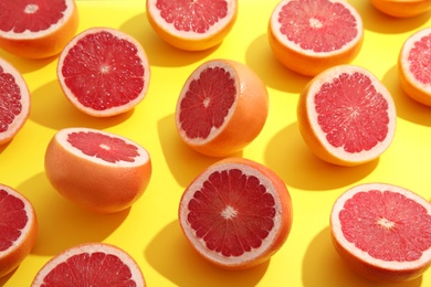 Fresh sliced ripe grapefruit on color background