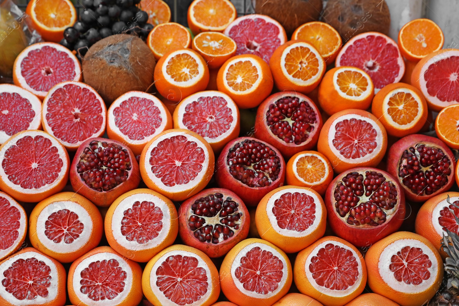 Photo of Pile of different fresh fruits and coconuts at outdoor market