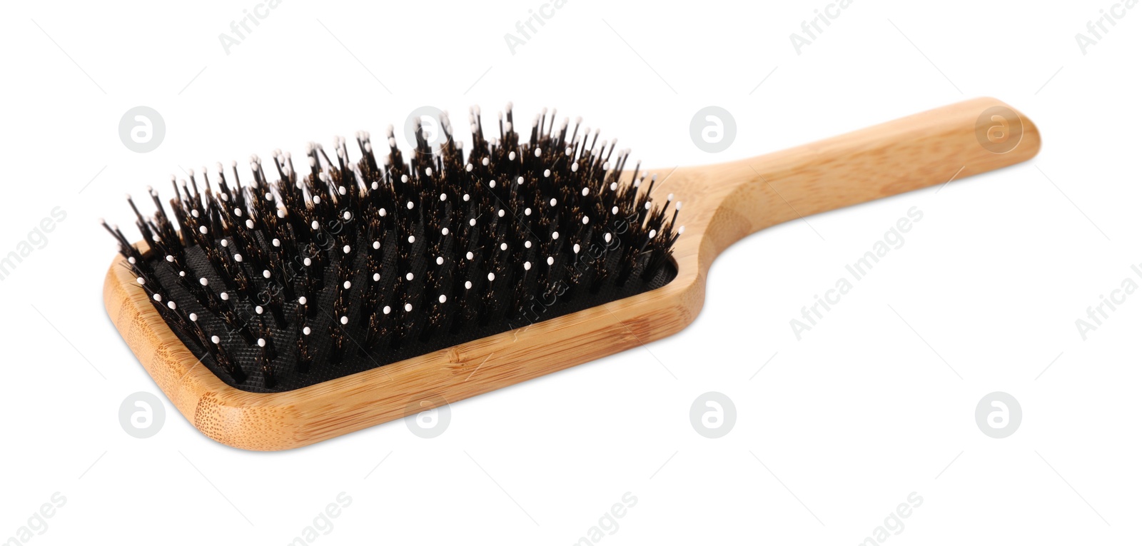 Photo of One new wooden hairbrush isolated on white