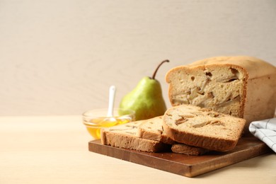 Composition with tasty pear bread on wooden table. Homemade cake