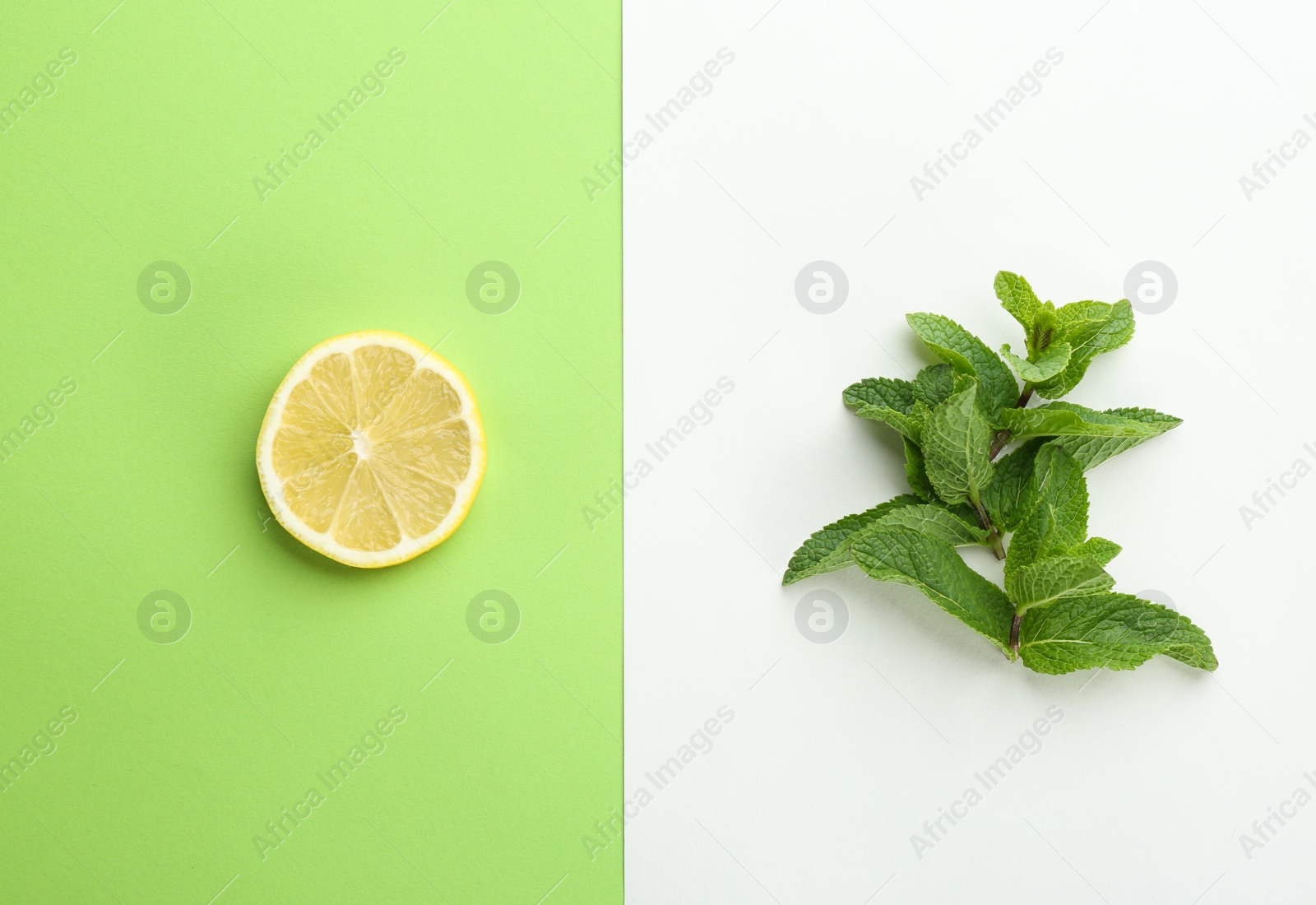 Photo of Fresh mint leaves and citrus fruit on color background, top view