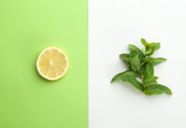 Photo of Fresh mint leaves and citrus fruit on color background, top view