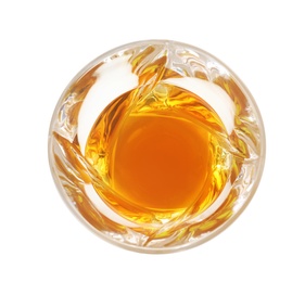 Glass of expensive whiskey on white background, top view