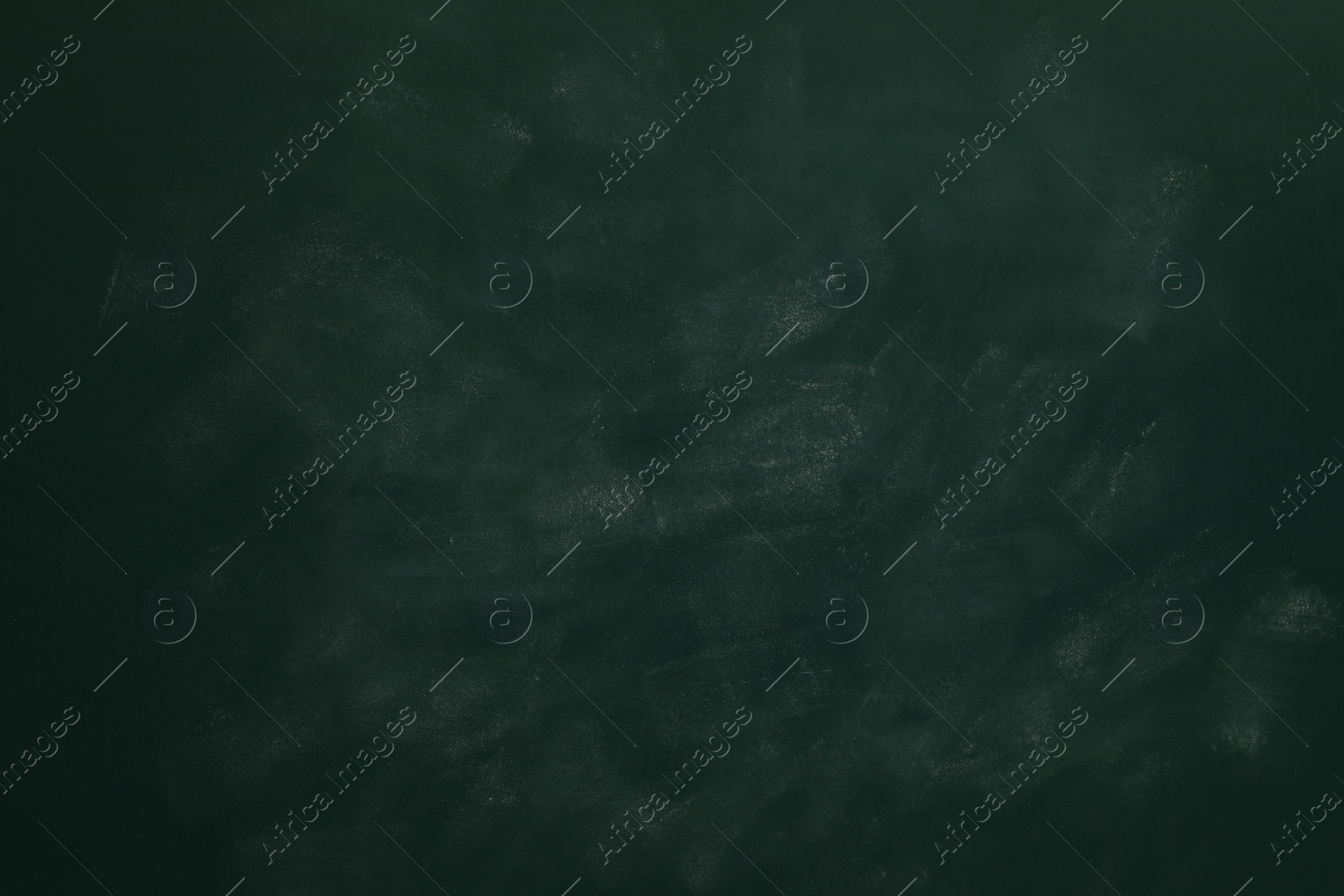 Photo of Chalk rubbed out on green chalkboard as background, closeup. Space for text