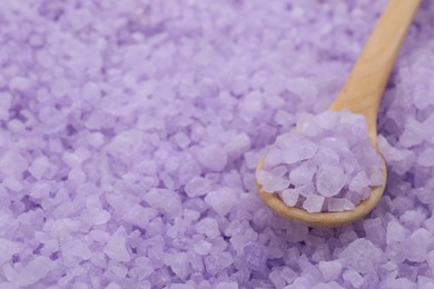 Photo of Spoon with violet sea salt, closeup. Space for text