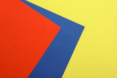 Colorful paper sheets as background, top view