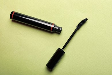 Mascara for eyelashes on light background, flat lay. Makeup product