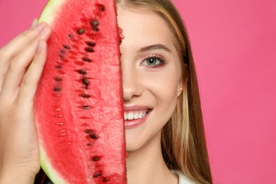 Photo of Beautiful girl with slice of watermelon on crimson background, closeup
