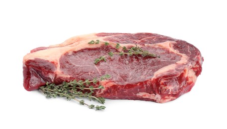 Photo of Piece of fresh beef meat and thyme isolated on white