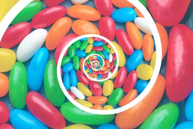 Whirl of many colorful jelly bean candies as background