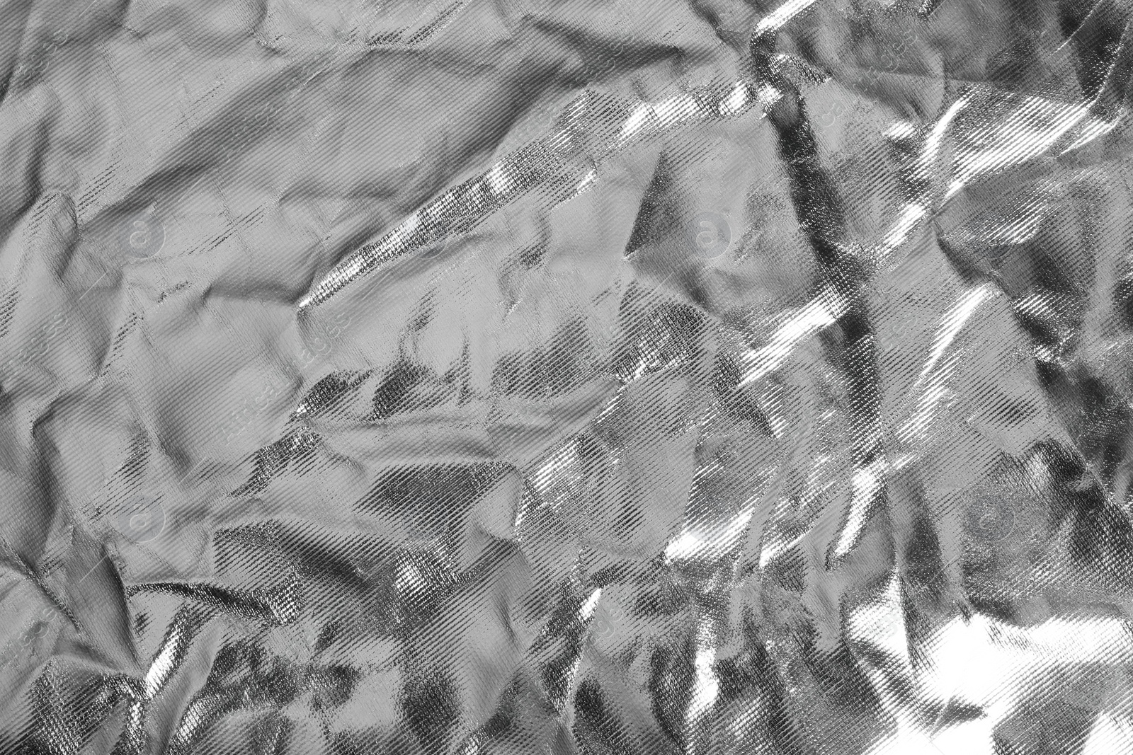 Image of Crumpled silver foil as background, closeup view