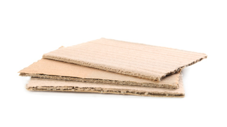 Photo of Pieces of brown cardboard isolated on white