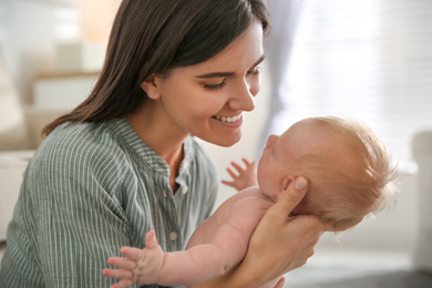 Mother with her newborn baby at home