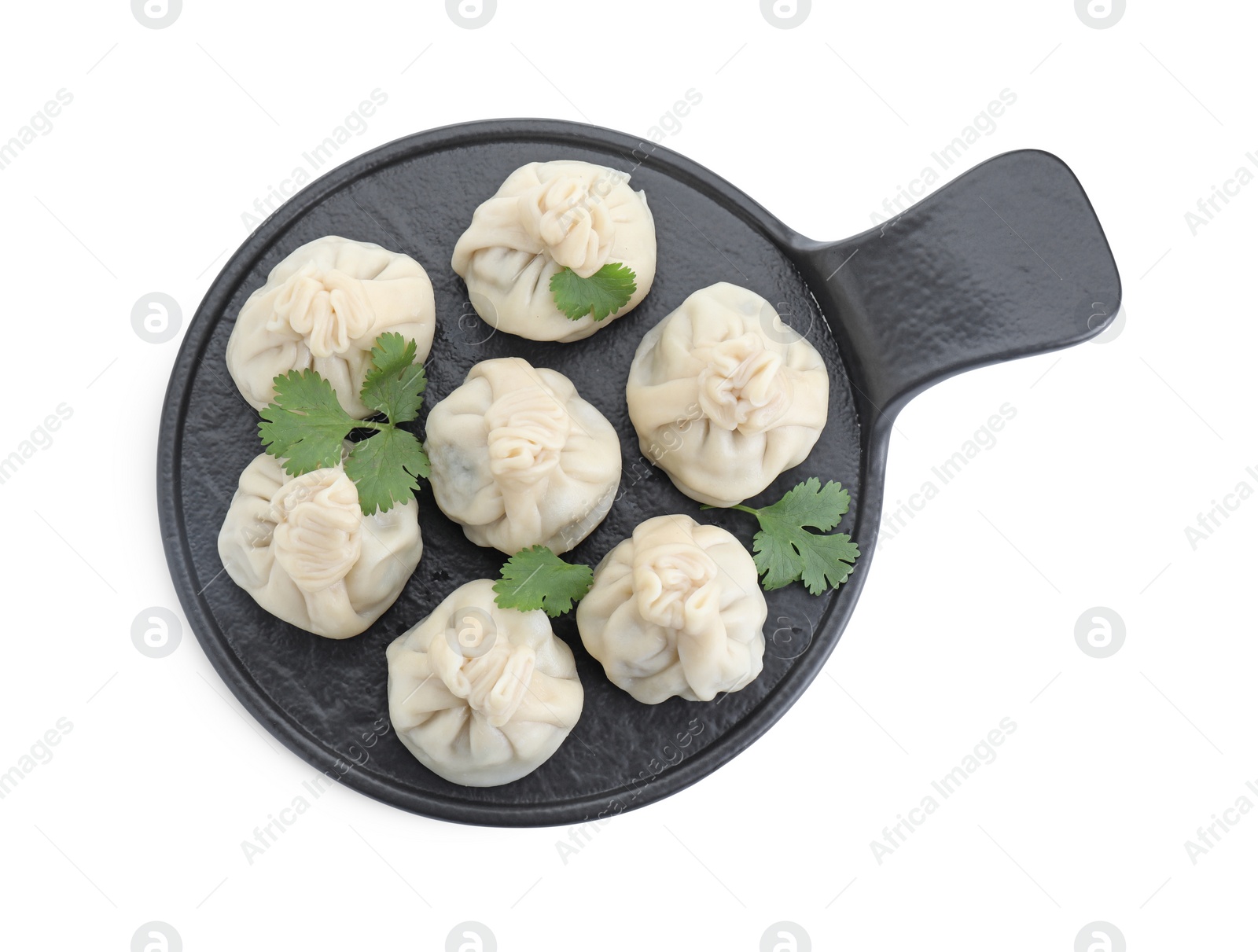 Photo of Serving board with tasty fresh khinkali (dumplings) and parsley isolated on white, top view. Georgian cuisine