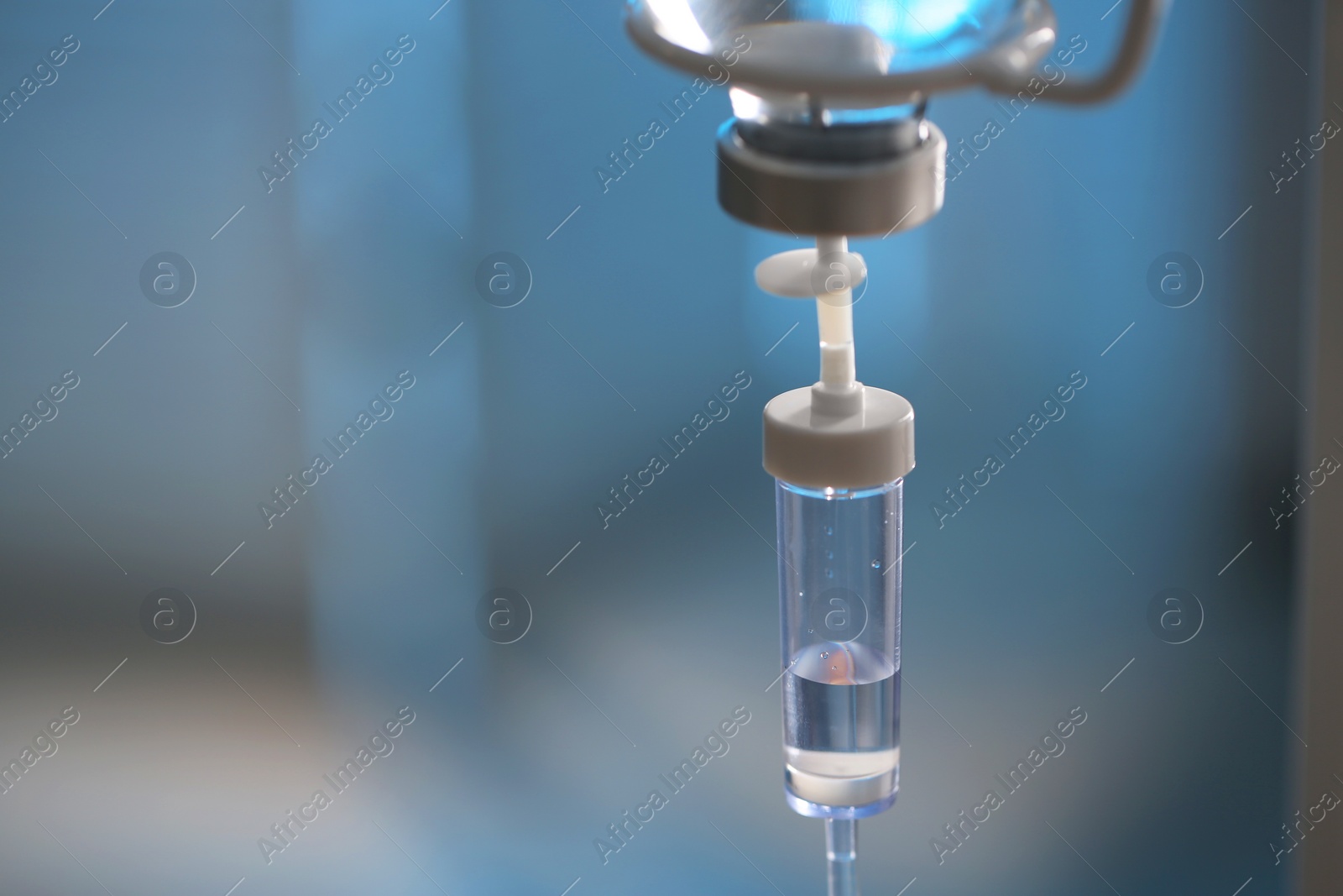 Photo of IV drip against blurred background, space for text